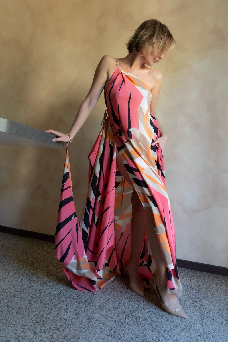 Coral Sunset silk dress shown with flowing draped train