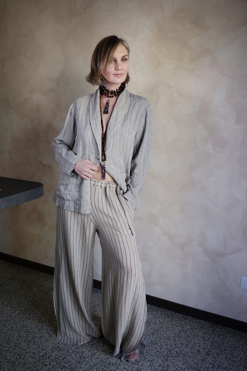 Grey pinstripe linen blazer with matching wide-leg trousers, full-length front view