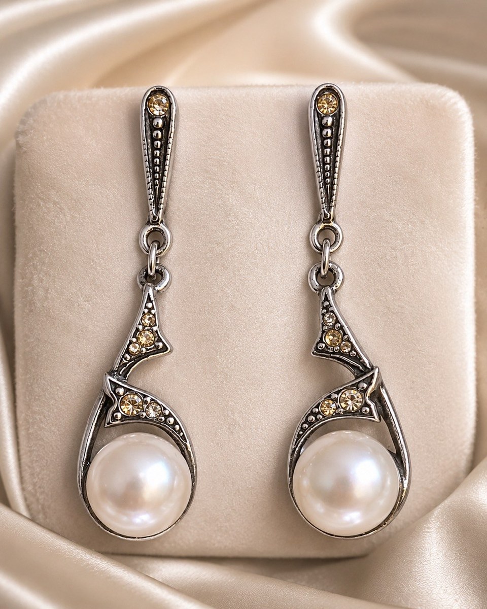 Pair of vintage-style silver drop earrings with white freshwater pearls and champagne crystal accents