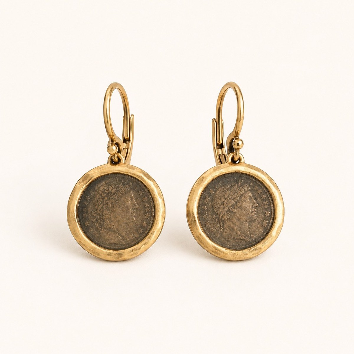 Pair of gold-tone drop earrings framing antiqued Roman-emperor coin reproductions on lever-back hooks