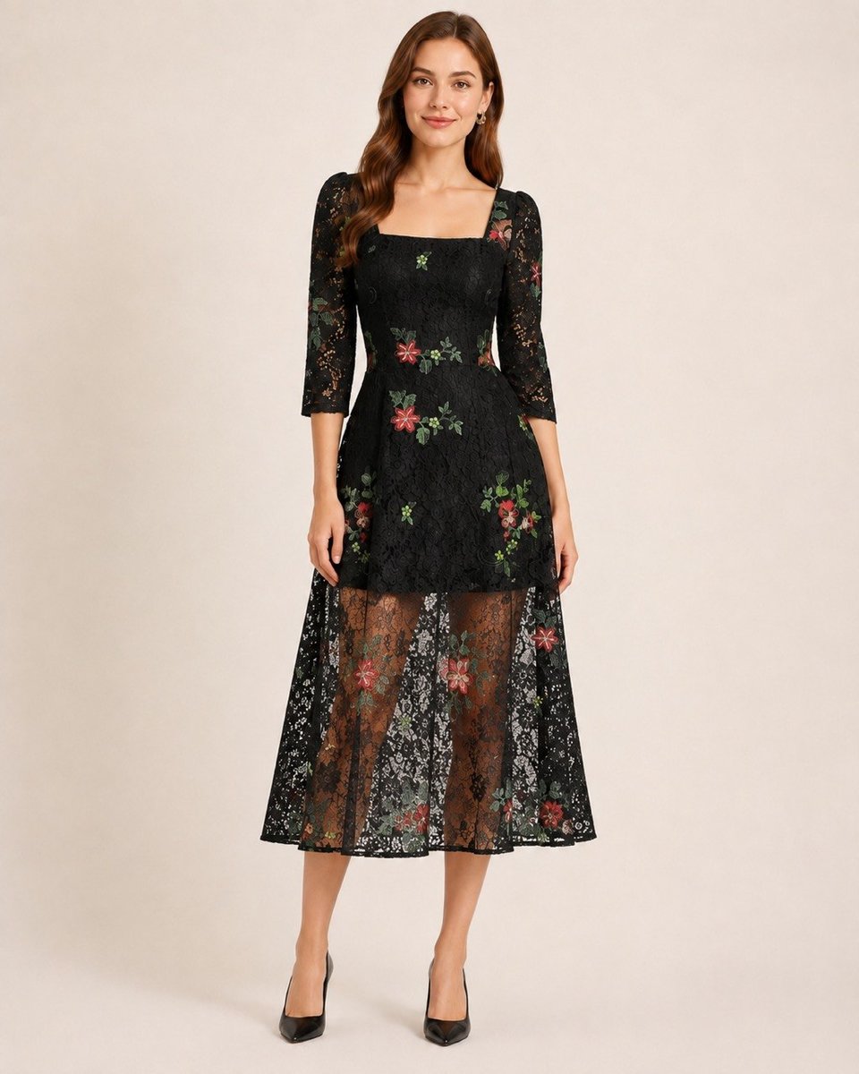 Black floral lace dress showing the sheer flared midi skirt